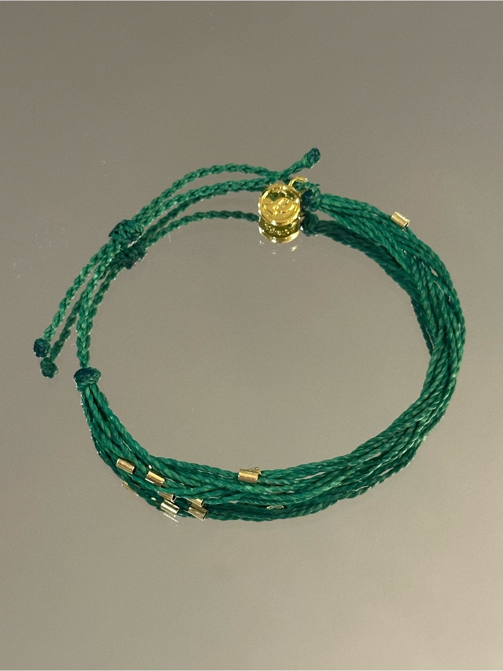 Pura Vida. Green Braided Cord Bracelet with Gold Accents